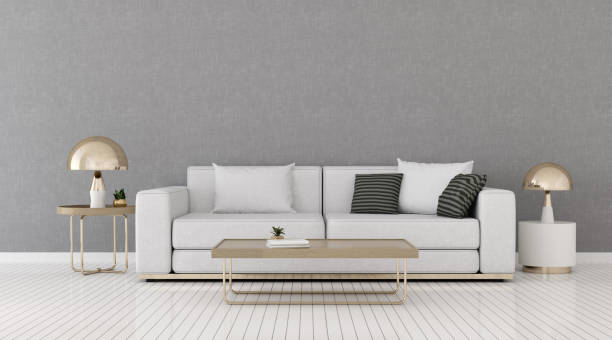 istock View of living room space with sofa and round side table on empty wall and bright laminate floor.Perspective of minimal interior design with gold lamp. 3d rendering. 1187335554