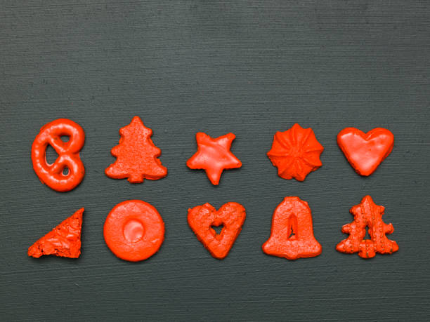 istock red christmas cookies on black background 1187335943