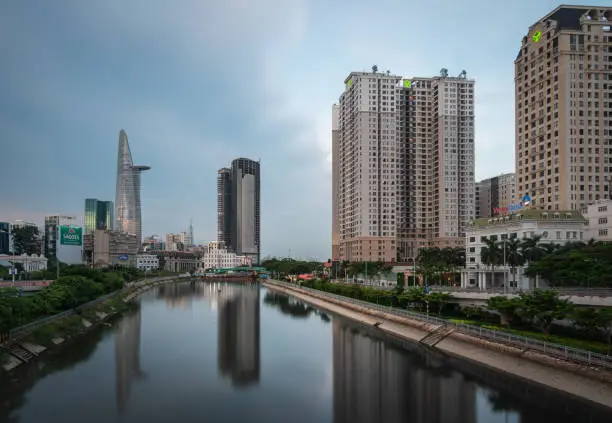 Photo of Saigon Cityscape at Sunrise. Skyline with cloudy sky, Modern City Skyline Riverside. ho chi minh , Vietnam.