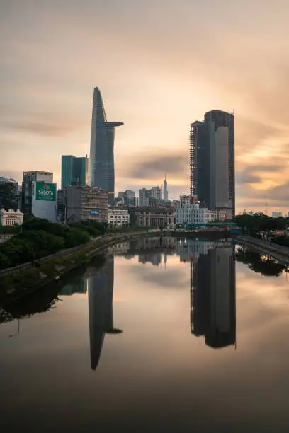 Photo of City Skyline of Ho Chi Minh cityscape at Sunset, Bitexco Tower in the financial area riverside. Saigon, Vietnam, vertical shot