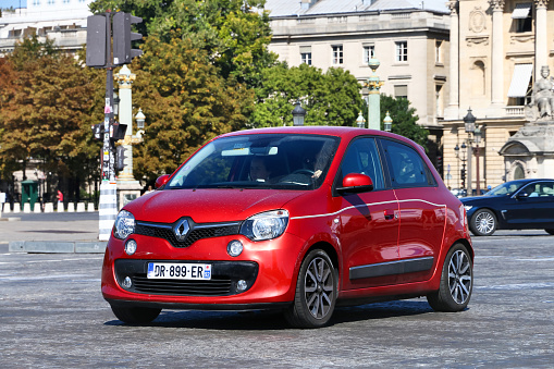 Paris, France - September 15, 2019: Red compact car Renault Twingo in the city street.