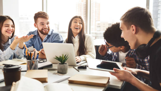 istock University friends enjoying group study in library 1187341633