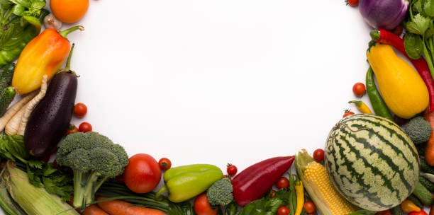 istock Organic fruits and vegetables with copy space on white 1187341690