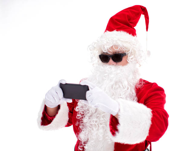 istock Happy  Santa Claus watching smart phone 1187343017