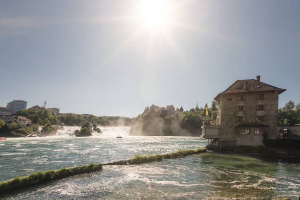 The Rhine Falls is one of the three largest waterfalls in Europe and an international landmark. It is located in Switzerland. Ideal for tourists: On extended paths you can reach viewing platforms on both sides of the Rhine.
