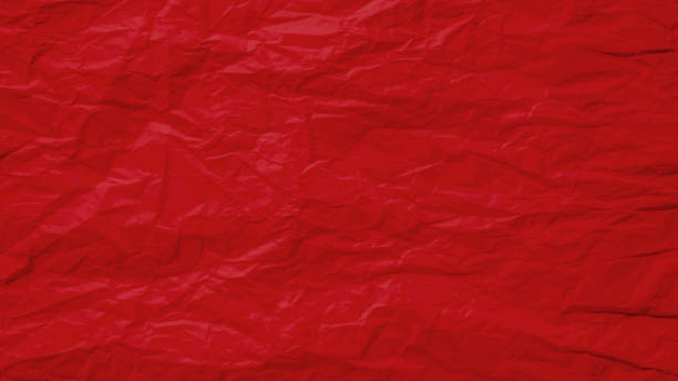 Red crumpled old with paper page texture rough background. Crease grunge parchment pattern vintage design.
