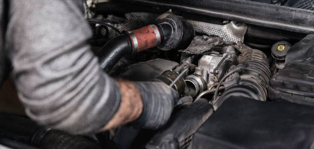 istock Auto Mechanic Disassembling the Machine Part in the Car 1187346883
