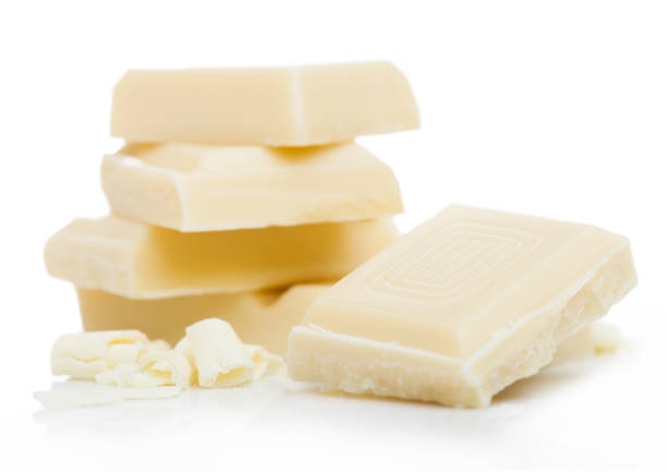 istock White chocolate pieces and curls isolated on white background 1187346892