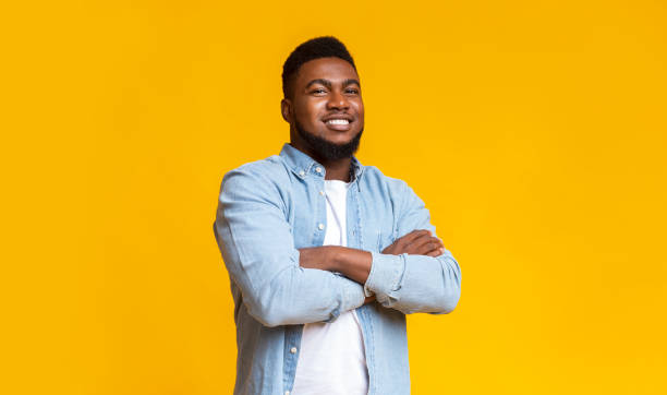 istock Confident african american guy standing with his arms crossed 1187348190