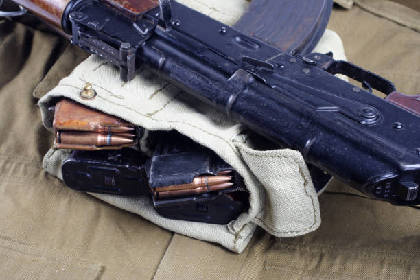 istock AK47 on USSR Soviet Army khaki uniform background 1187349019
