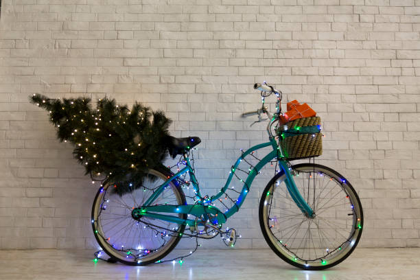 istock Christmas greeting card with blue bicycle decorating by lights 1187349051