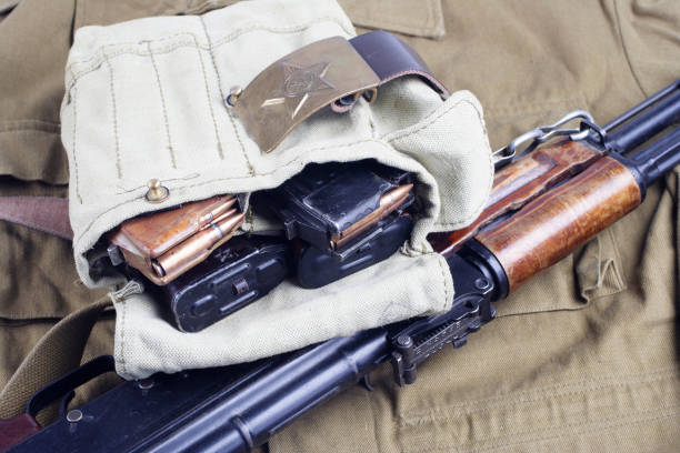 istock AK47 on USSR Soviet Army khaki uniform background 1187349176