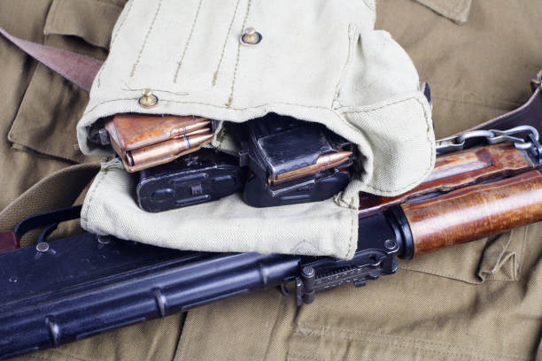 istock AK47 on USSR Soviet Army khaki uniform background 1187349239