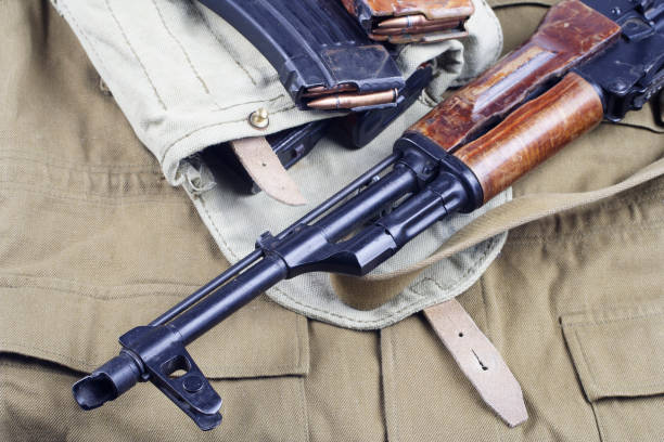 istock AK47 on USSR Soviet Army khaki uniform background 1187349301