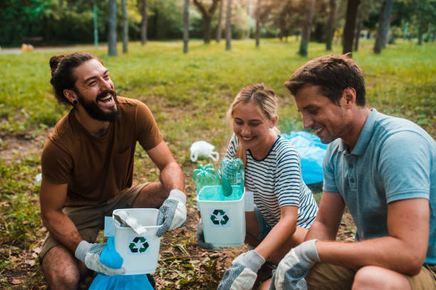 istock Friends cleaning the park together 1187350674