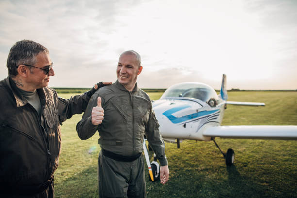 A young man piloting an airplane.