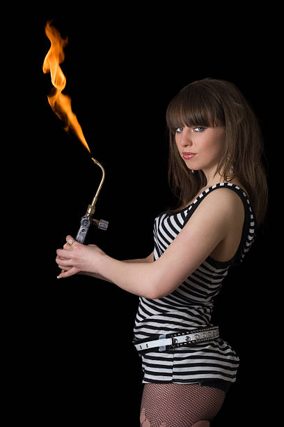 istock Pretty young woman with a gas torch. Isolated 118735213