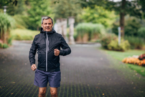 istock An older businessman doing morning stretching 1187352283
