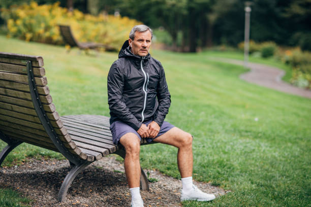 istock An older businessman doing morning stretching 1187352288