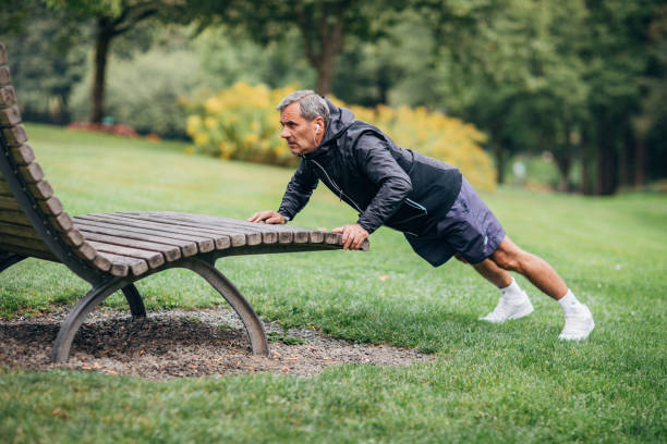 istock An older businessman doing morning stretching 1187352308