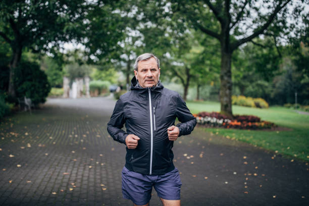 istock Senior businessman doing morning jogging 1187352409