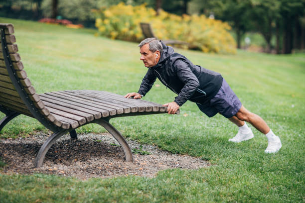 istock An older businessman doing morning stretching 1187353158