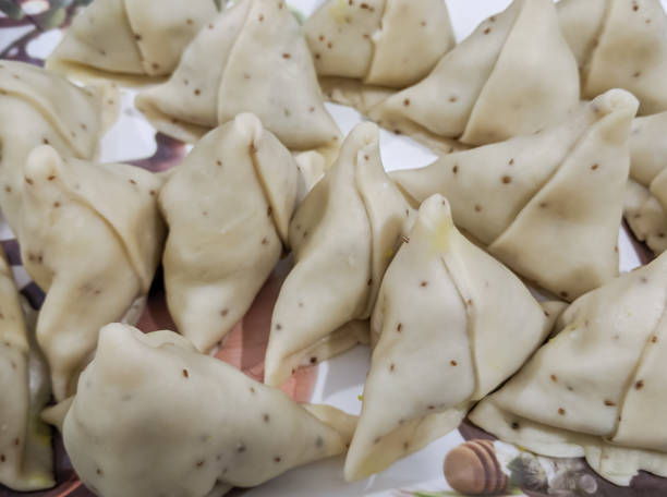Raw Samosa ready to be fried - famous Asian snack food