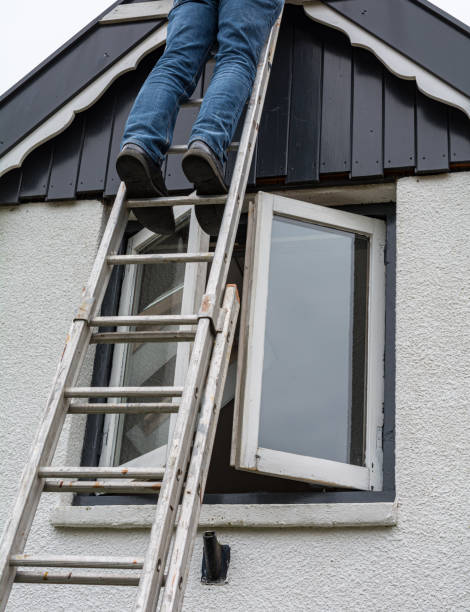 istock Man standing on ladder 1187353212