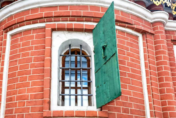 Russian ancient architecture. Old brick wall with an old window of Saint Basil's (Pokrovsky) Cathedral in Moscow, Russia