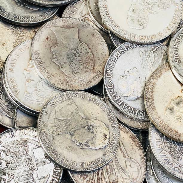 istock money - old coins on an antique stall 1187354834