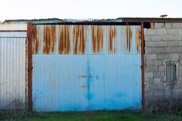 istock Big rusty door of a warehouse 1187356225