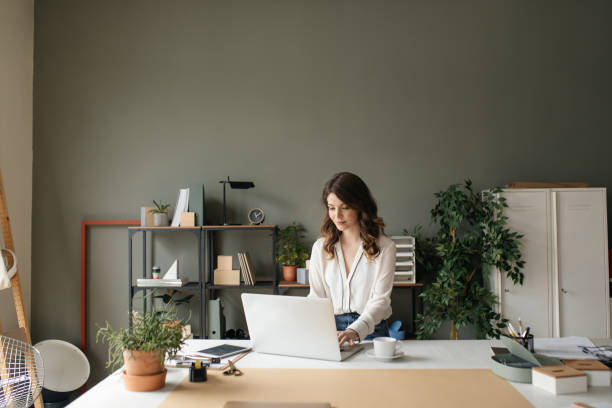 istock Pretty Businesswoman Enjoying Her Work 1187356561