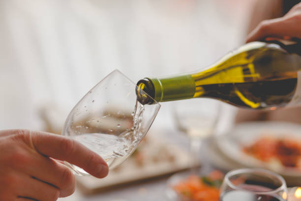 istock Close up of pouring white wine. 1187357662