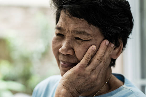 TMD and TMJ healthcare concept: Temporomandibular Joint and Muscle Disorder. Asia man hand on cheek face as suffering from facial pain, mumps or toothache TMD and TMJ healthcare concept: Temporomandibular Joint and Muscle Disorder. Asia man hand on cheek face as suffering from facial pain, mumps or toothache salivary gland surgery stock pictures, royalty-free photos & images