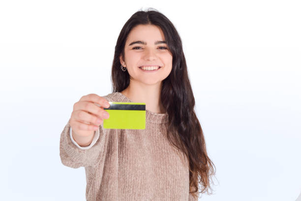 istock Woman holding credit card. 1187358355