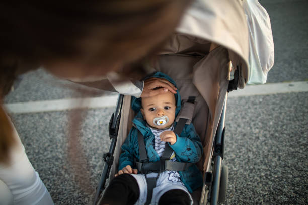 istock Mother checking baby's temperature with her hand 1187358416