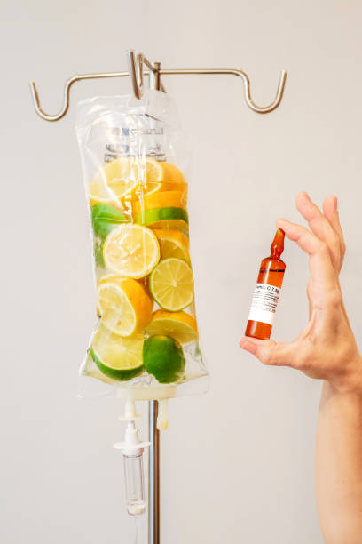 The Vitamin C Drip This premium drip is the perfect blend of essential micronutrient vitamins and minerals. IV administration of these high dose vitamins will optimise vitamin levels. This drip contains high dose B12 which is one of eight B vitamins that helps the body convert food into glucose, providing you with energy. ascorbic acid stock pictures, royalty-free photos & images