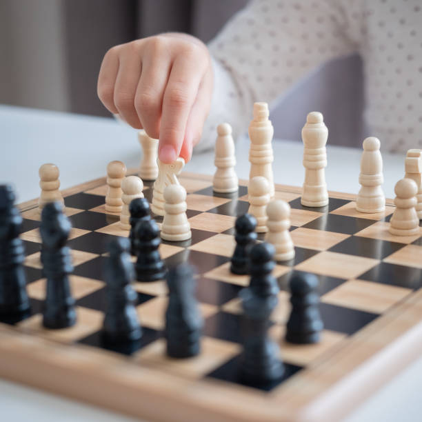 istock a girl learn how to play chess game 1187360744