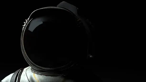 Photo of Astronaut in a metal helmet close-up in the light and dark. Computer generated space background, 3D rendering
