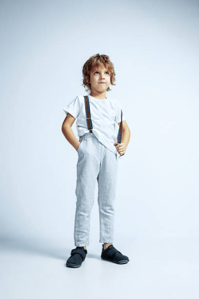 istock Pretty young boy in casual clothes on white studio background 1187360936
