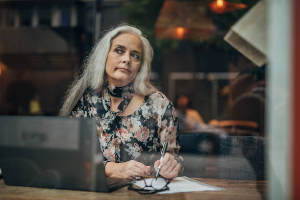 istock Businesswoman sitting alone in cafe 1187361301
