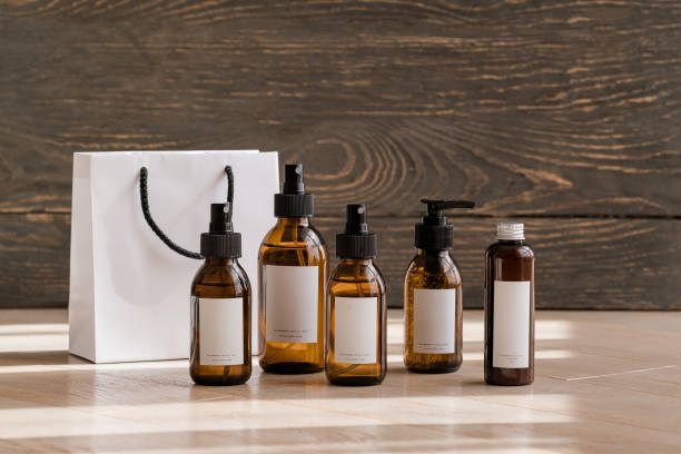istock Cosmetic dark amber bottles on wooden  table 1187361403