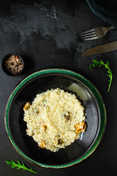 istock risotto mussels main course (delicious rice with seafood) menu concept. food background. top view. copy space 1187361552