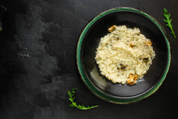 istock risotto mussels main course (delicious rice with seafood) menu concept. food background. top view. copy space 1187361555