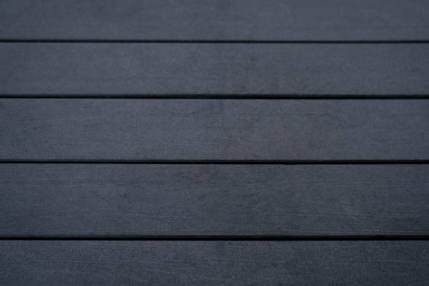 istock Dark gray hardwood floor wood planks background 1187363447