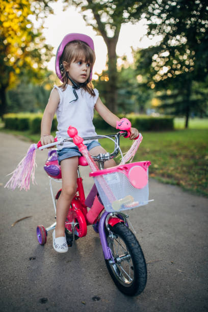 istock Cute girl riding bicycle 1187365972