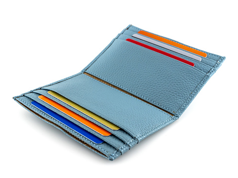Blue business card holder with colorful plastic cards on a white background.