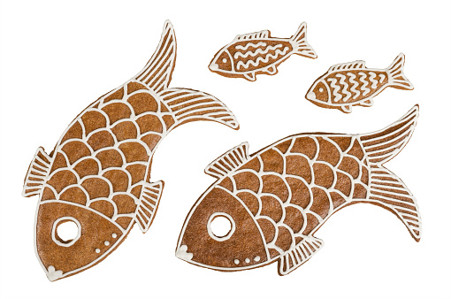 Ornate hand painted gingerbread fishes isolated on a white background. Fragrant confections detail