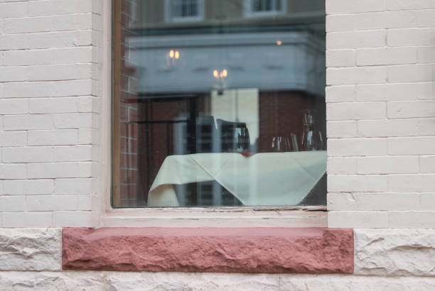 istock Empty wine glass And Table At Cafe Seen Through Glass Window 1187370684