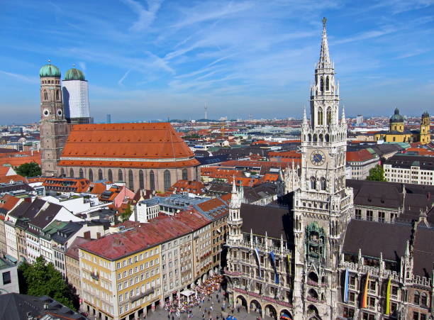 Munich, Germany - September 2010: City centre pedestrian zone at Marienplatz where you can see the new Town Hall and the Cathedral of Our Dear Lady (Frauenkirche).
